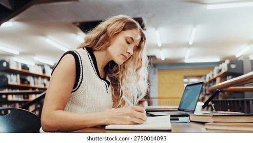 Student writing an academic paper in Ashburn
